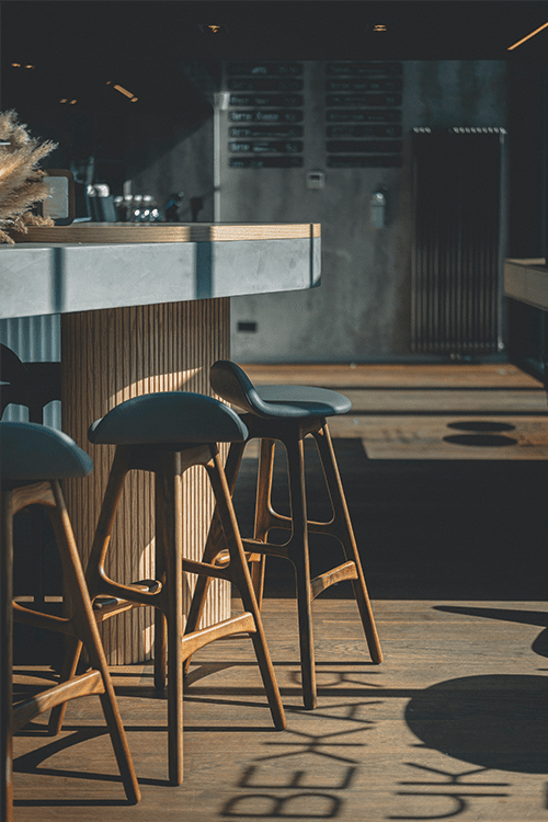 Moody restaurant bar with high chairs