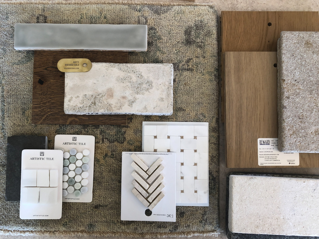 A material board showcasing design elements for a room, including tiles, a rug, flooring options, and fabrics.